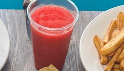 Strawberry smoothie in plastic cup
